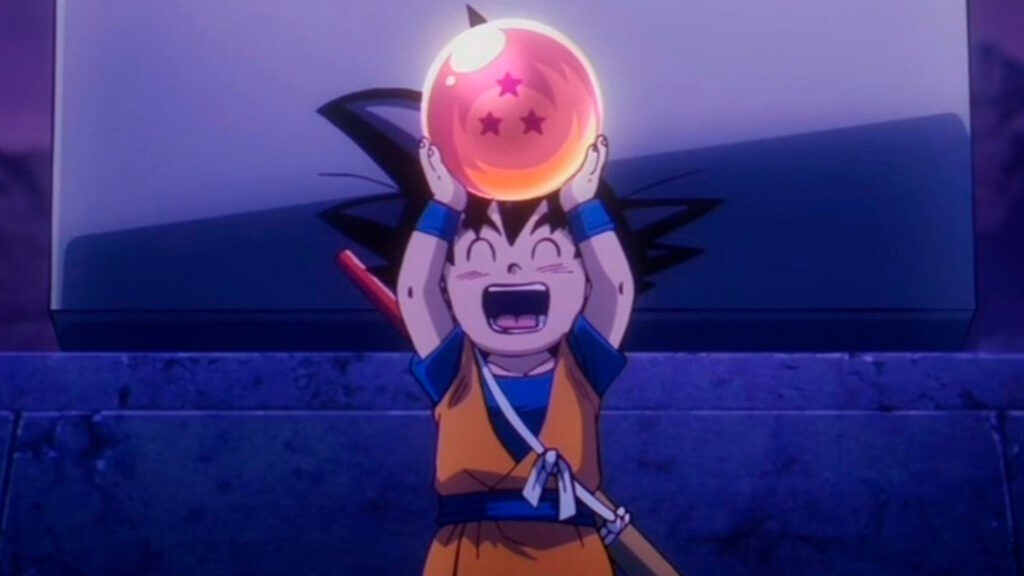 Dragon Ball DAIMA Goku con una sfera del drago